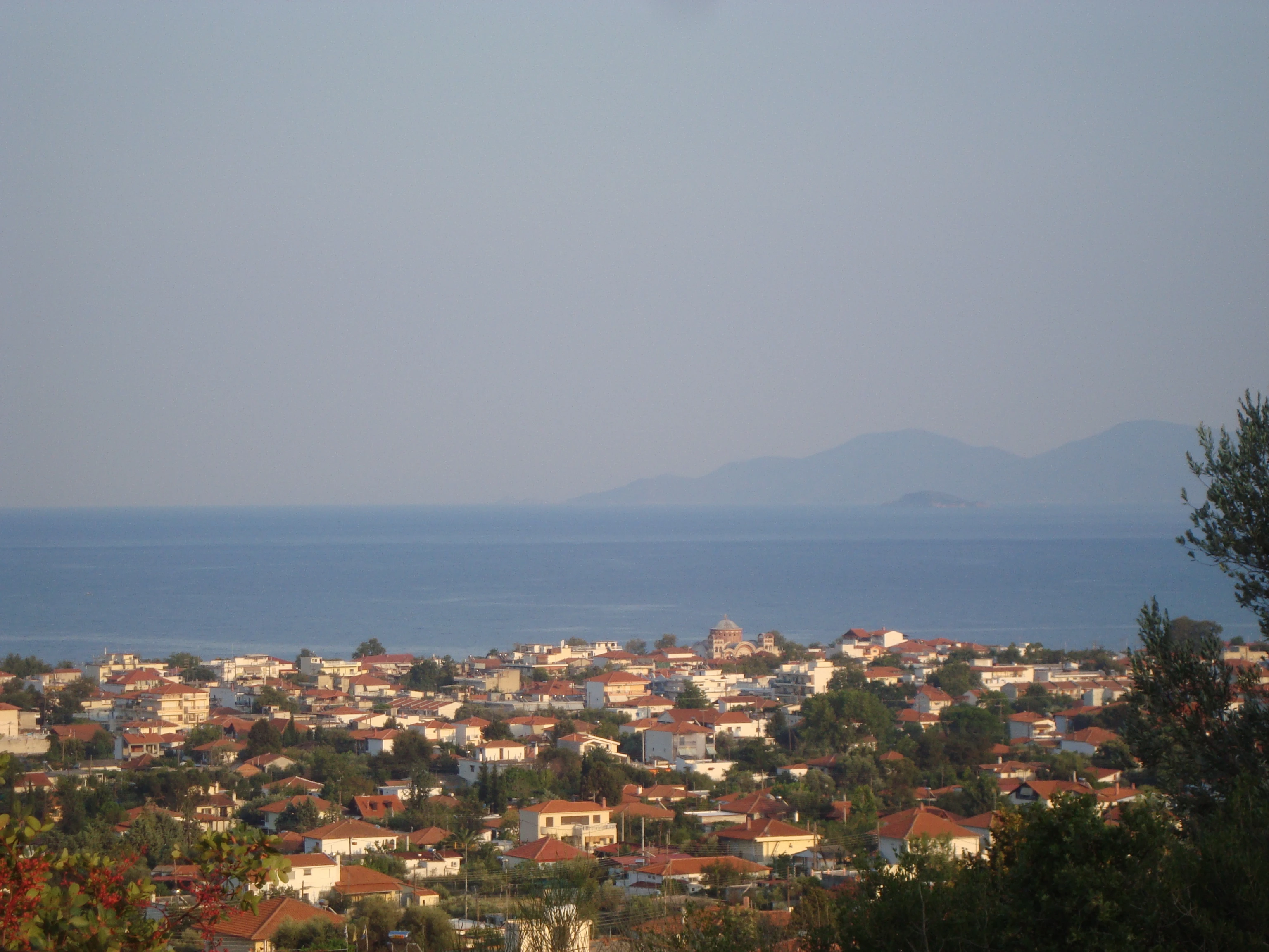 Panoramic view of Asprovalta rooftops overlooking the sea and distant hills